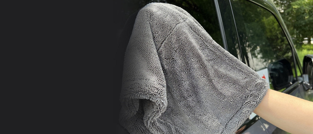 Charcoal twisted-loop towel drying a car