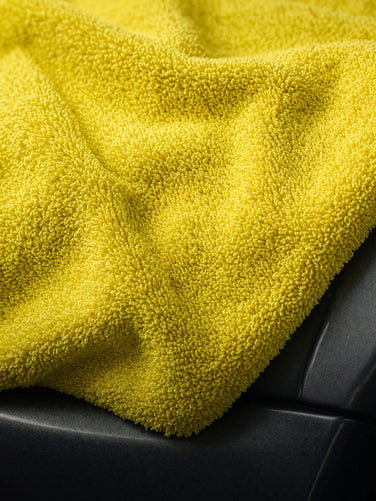 Shop All mega menu, yellow microfiber on car, full bleed