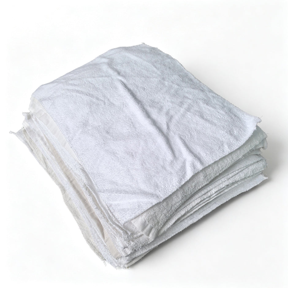 sewing little square white toweling rags