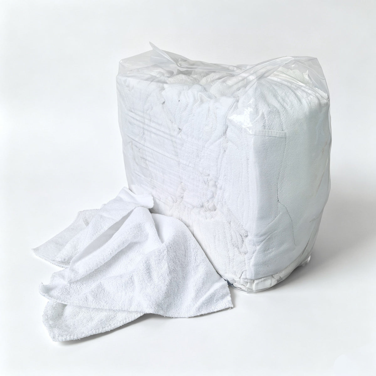 sewing little square white toweling rags